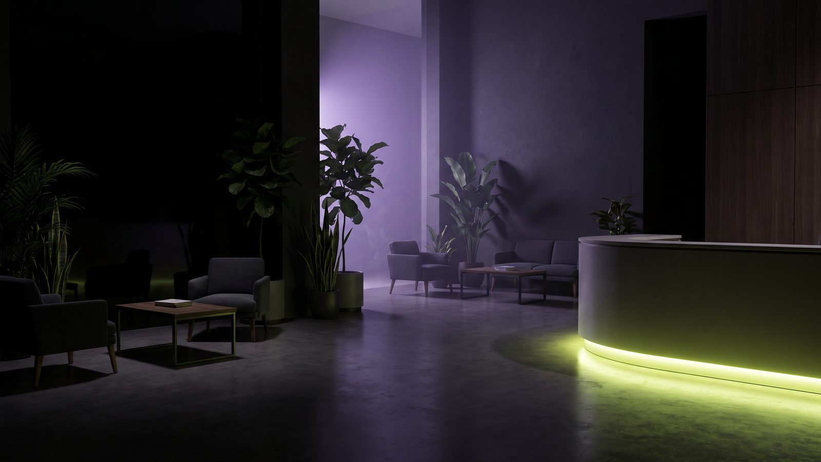 A quiet treatment centre lobby at night with plants, seating and a soft green light along the reception counter.