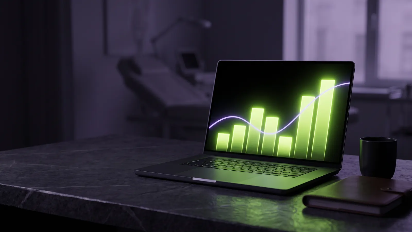 A laptop on a dark desk in a clinic office, its screen showing abstract green and violet bars.
