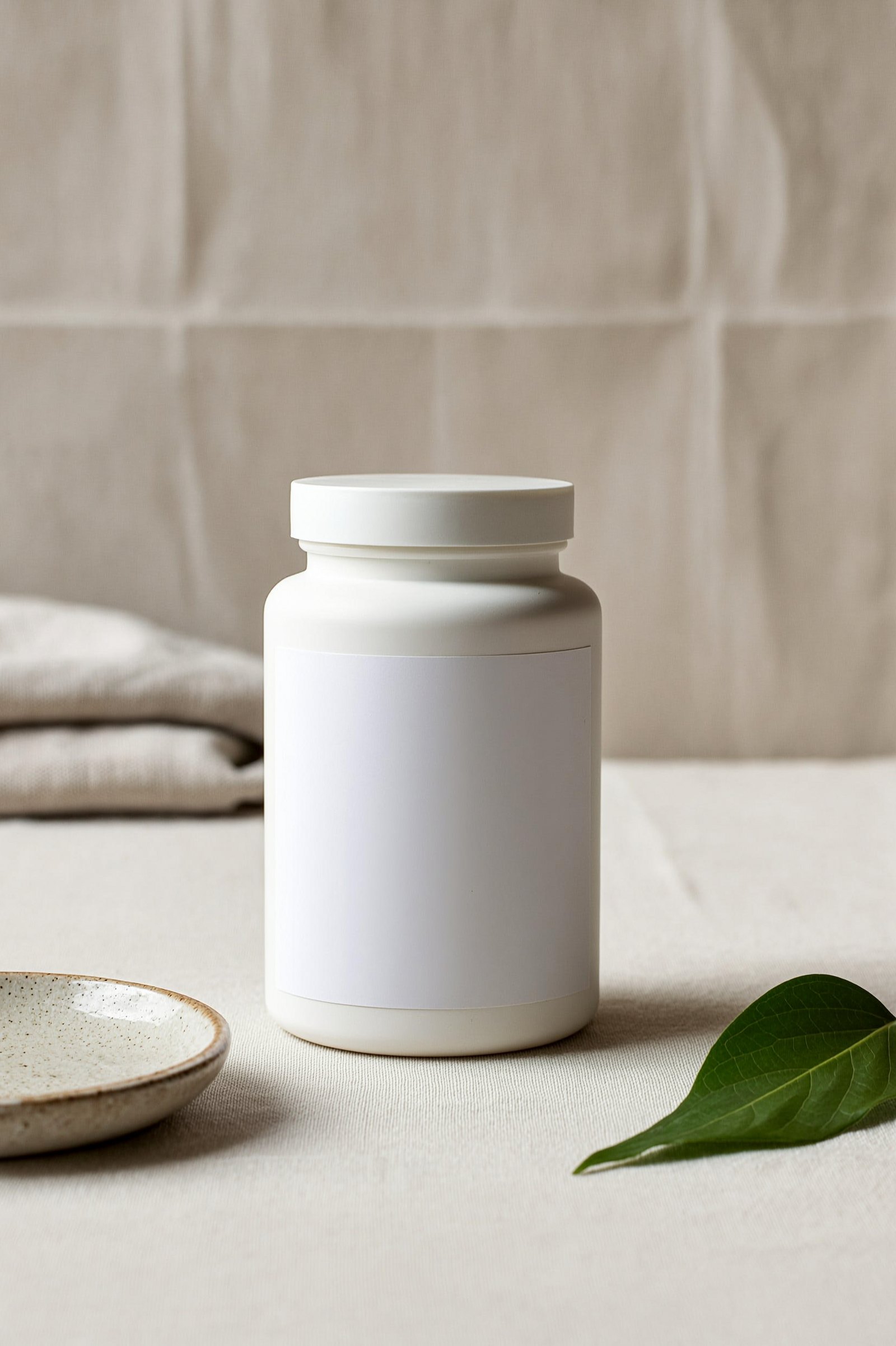 Blank-label white supplement bottle on linen, concept render by PELORA, not a client product