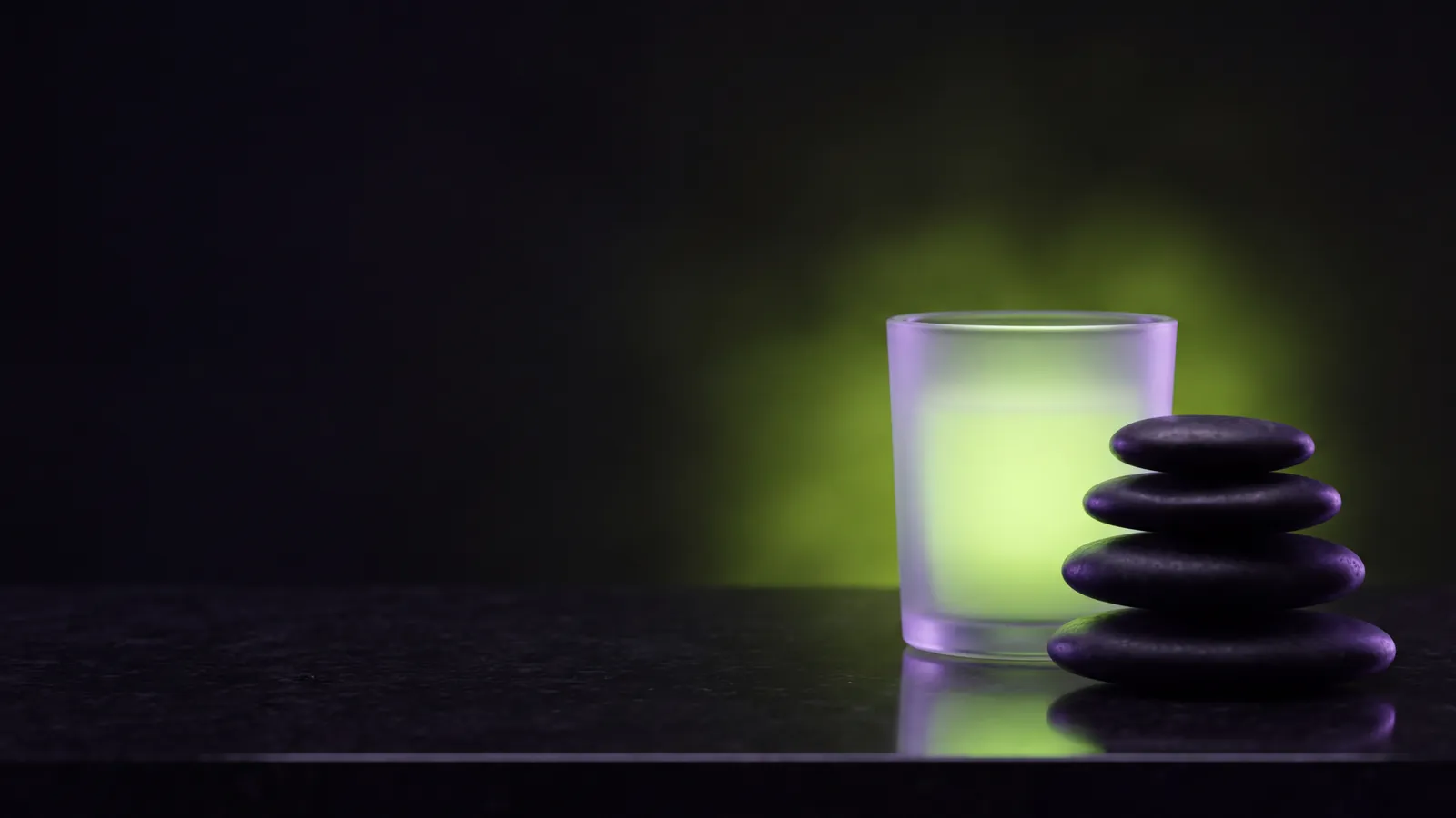 Concept render: stacked stones and a glass vessel in green glow